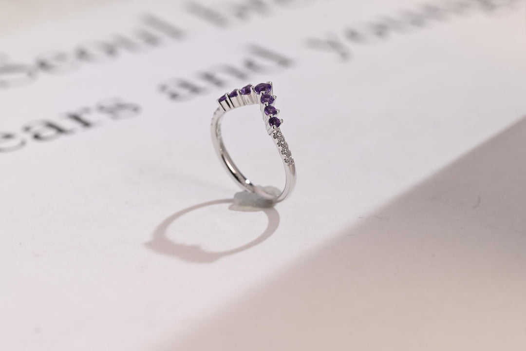 Side view of emerald diamond wedding band