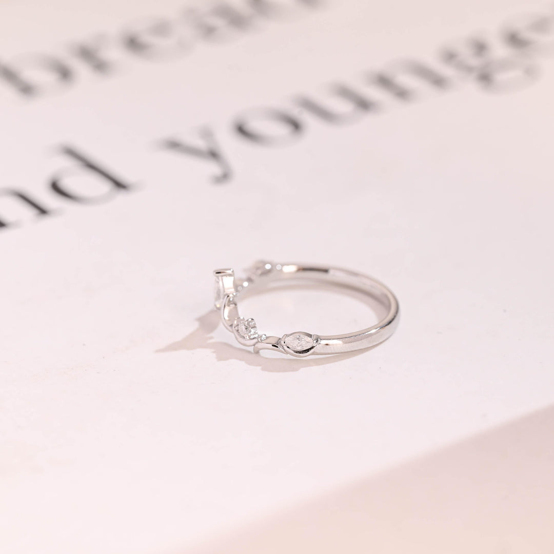 Side view of marquise & round diamond wedding band