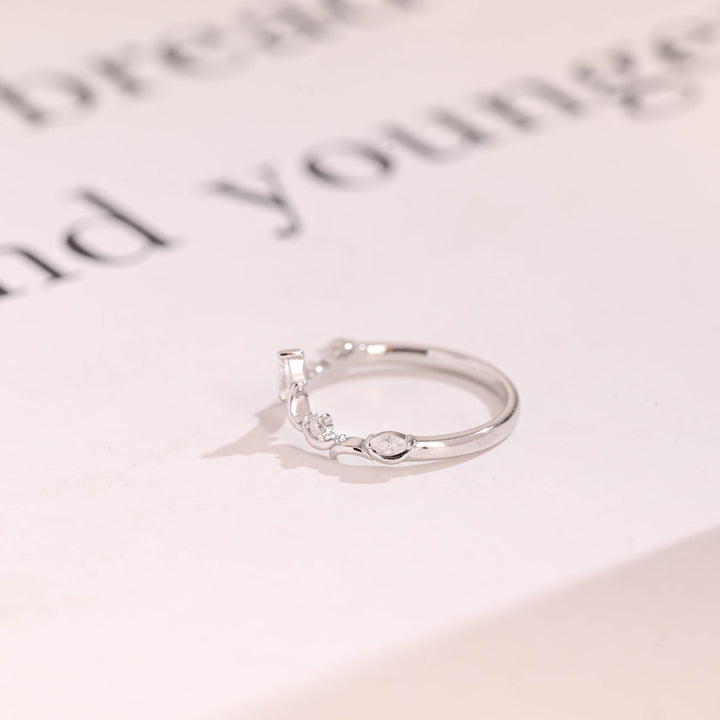 Side view of marquise & round diamond wedding band