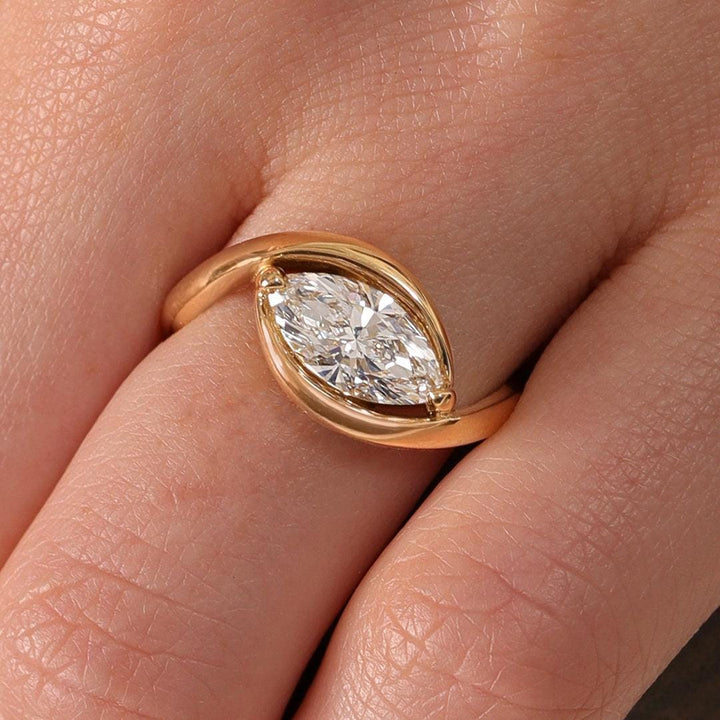 Marquise solitaire engagement ring close-up highlighting diamond sparkle