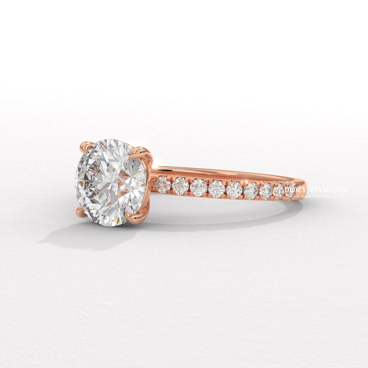Profile view of round cut pave engagement ring band