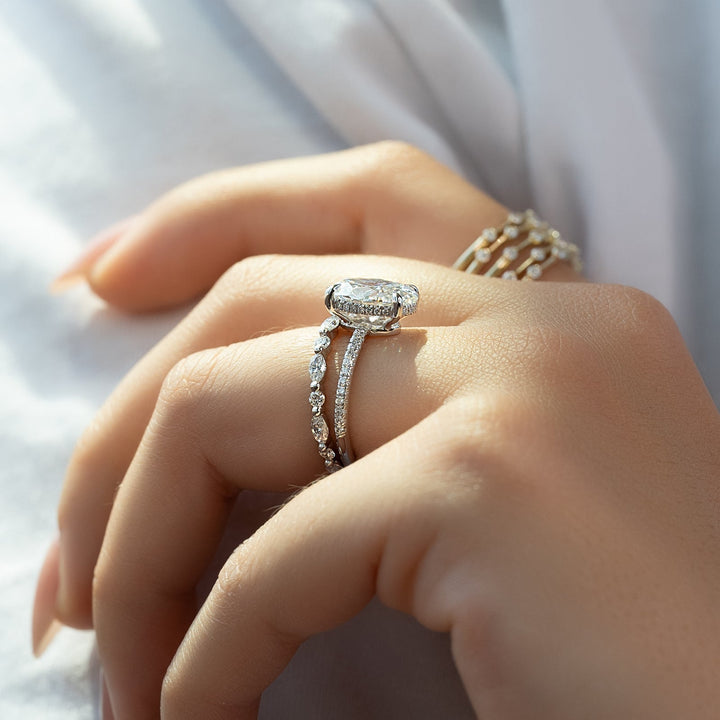 Side angle of oval hidden halo diamond engagement ring