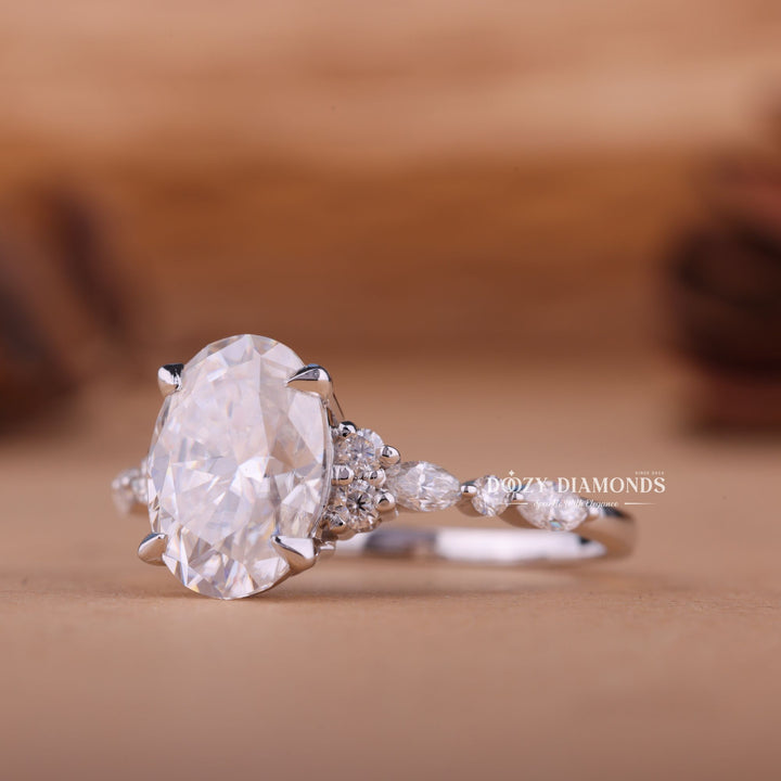 Oval cluster ring set with an IGI graded diamond