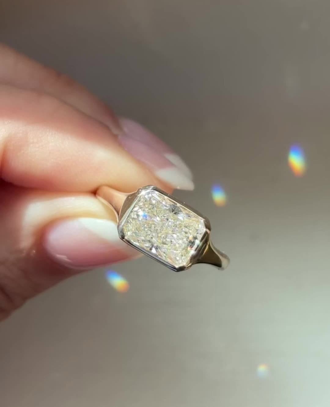 Radiant cut engagement ring side view showing band detail