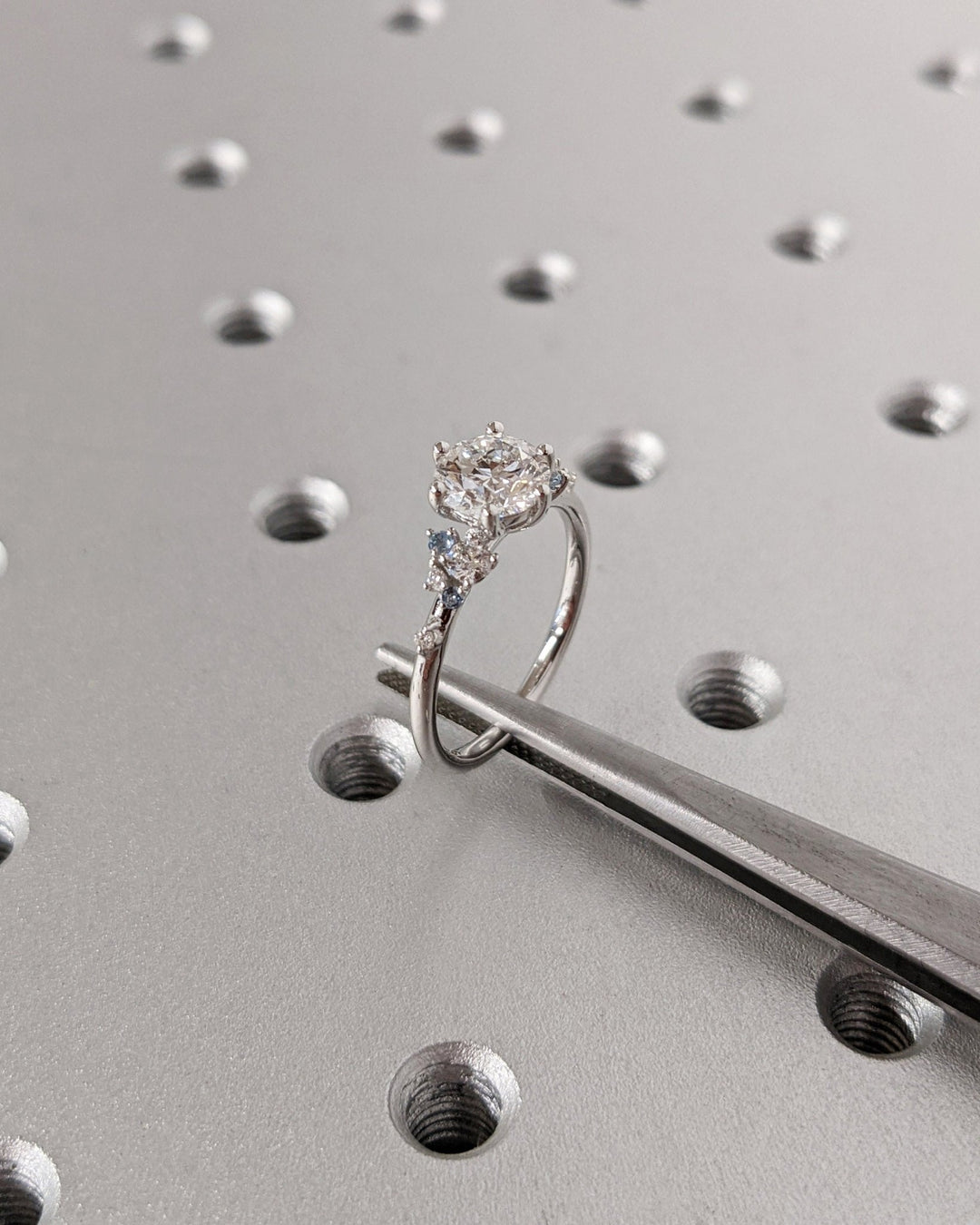 Side angle of round cluster diamond engagement ring