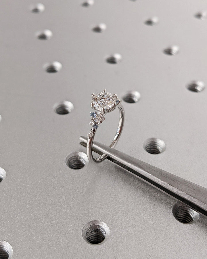 Side angle of round cluster diamond engagement ring