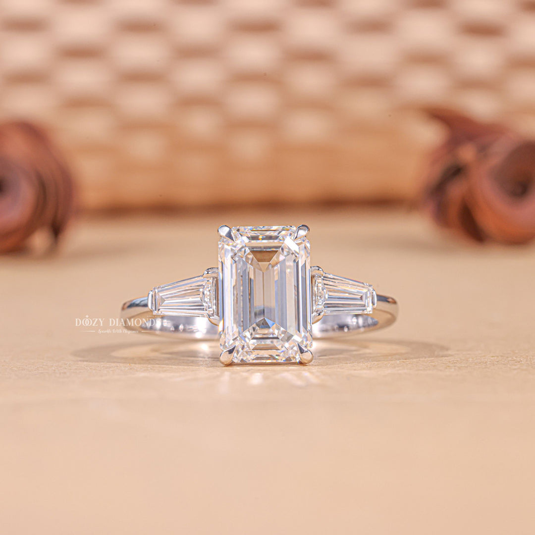 3.0CT emerald cut three stone engagement ring available to buy now