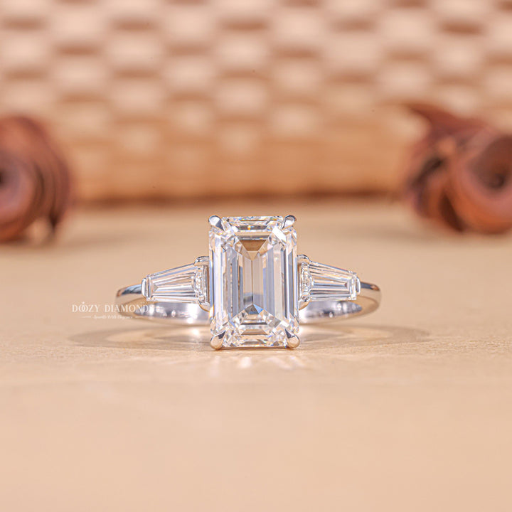 3.0CT emerald cut three stone engagement ring available to buy now