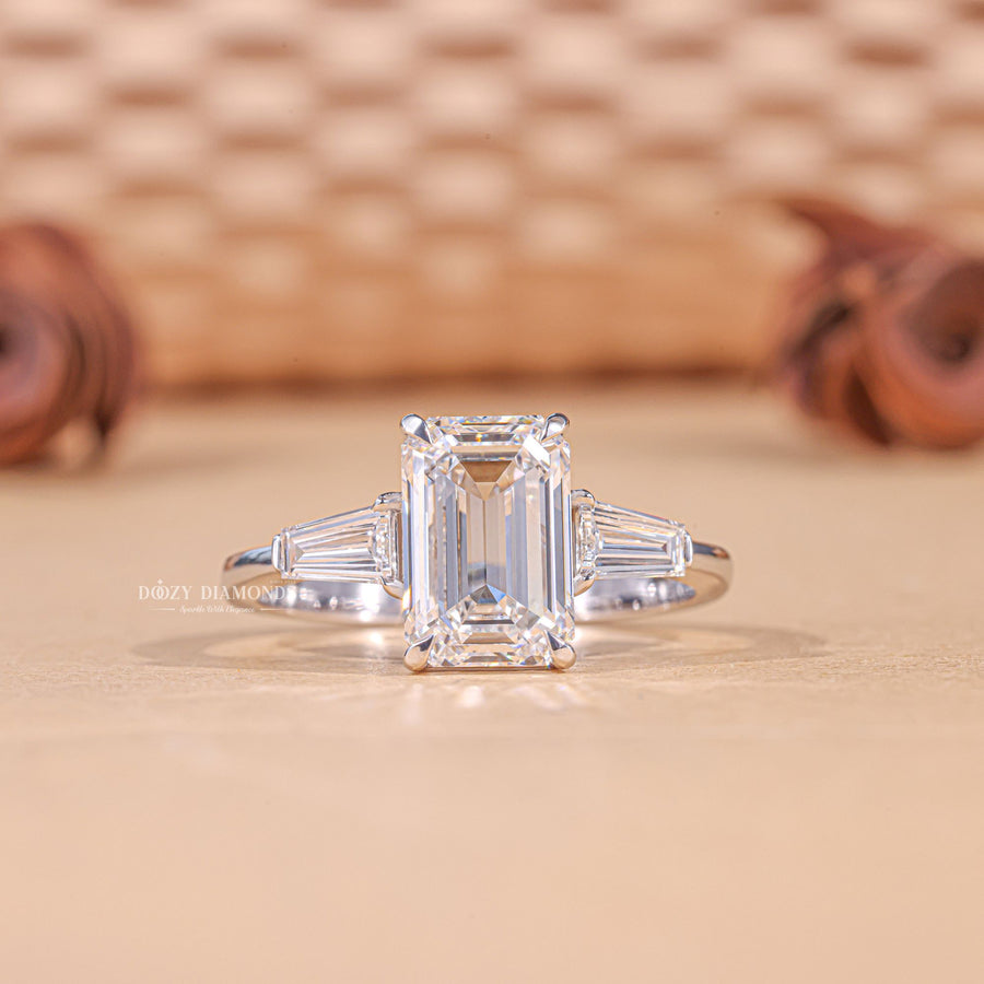 3.0CT emerald cut three stone engagement ring available to buy now