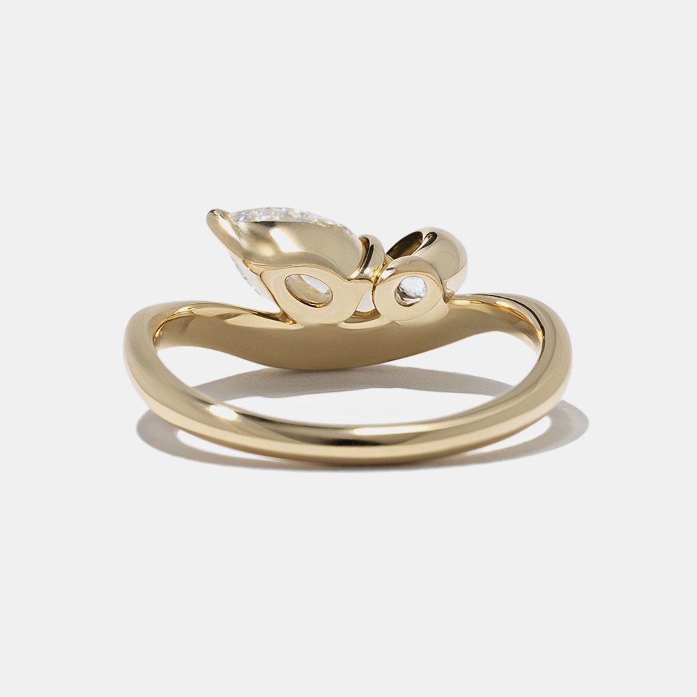 Oval bezel engagement ring offered in gold and platinum