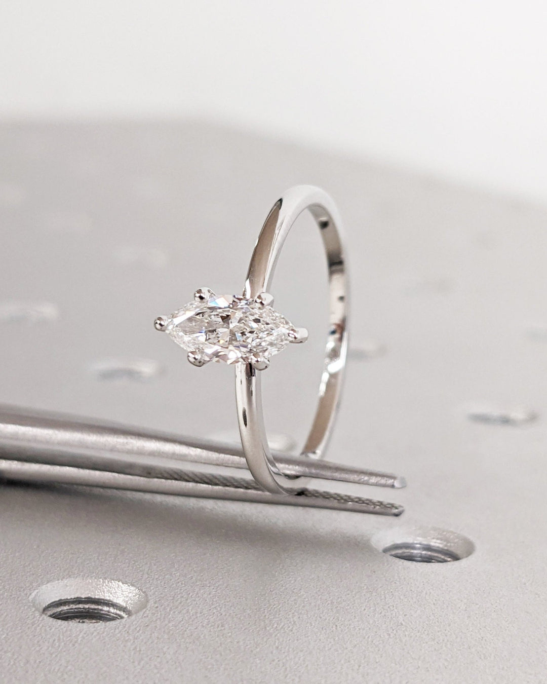 Profile view of marquise cut solitaire engagement ring band