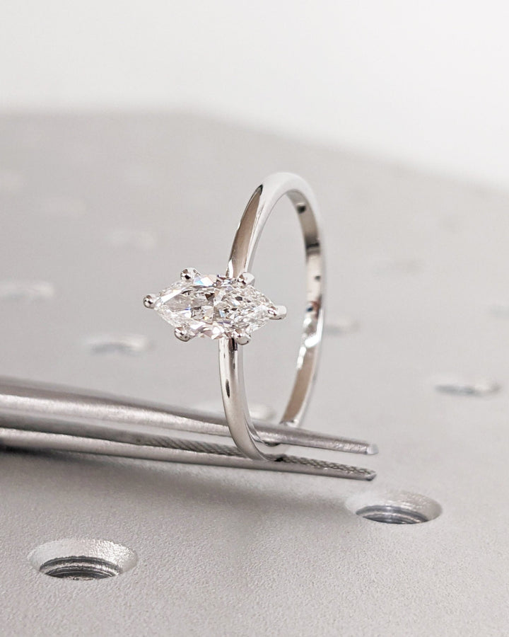 Profile view of marquise cut solitaire engagement ring band
