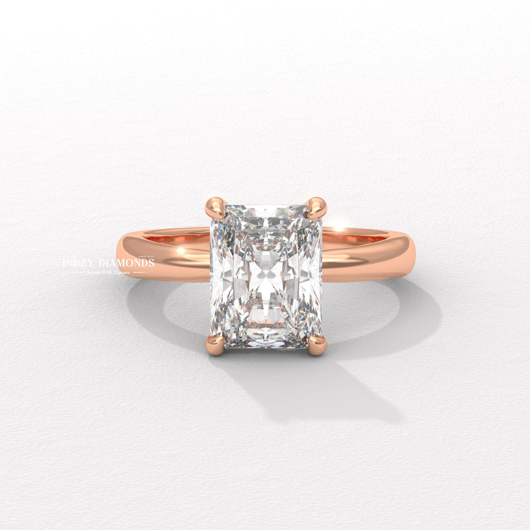 Radiant hidden halo engagement ring shown on hand for true-to-life sizing