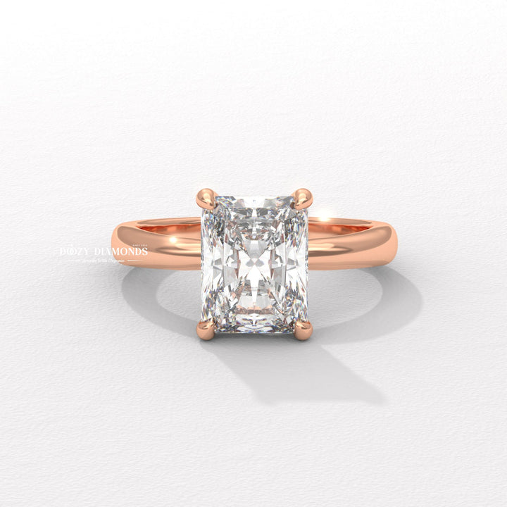 Radiant hidden halo engagement ring shown on hand for true-to-life sizing