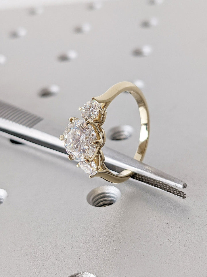 Shop the round cut three stone engagement ring collection online