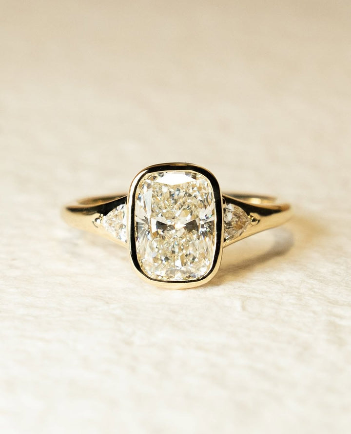 Cushion bezel engagement ring close-up showing high clarity diamond clarity