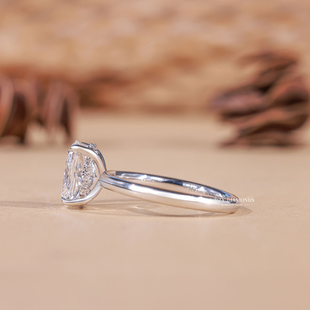 Cushion cut diamond ring worn on hand