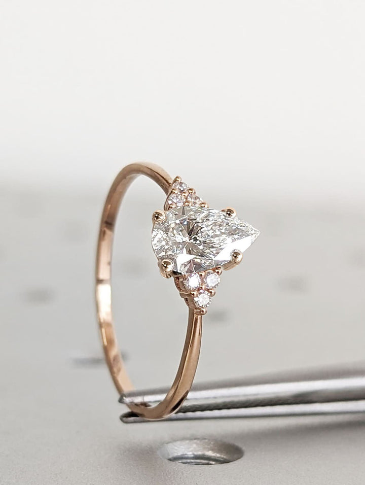 1.0CT pear cut cluster engagement ring available to buy now