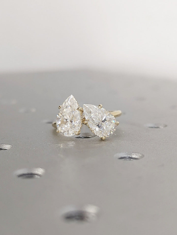 Pear cut engagement ring side view showing band detail