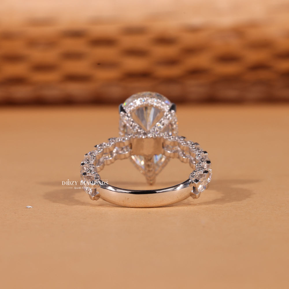 Pear pave engagement ring close-up highlighting diamond sparkle