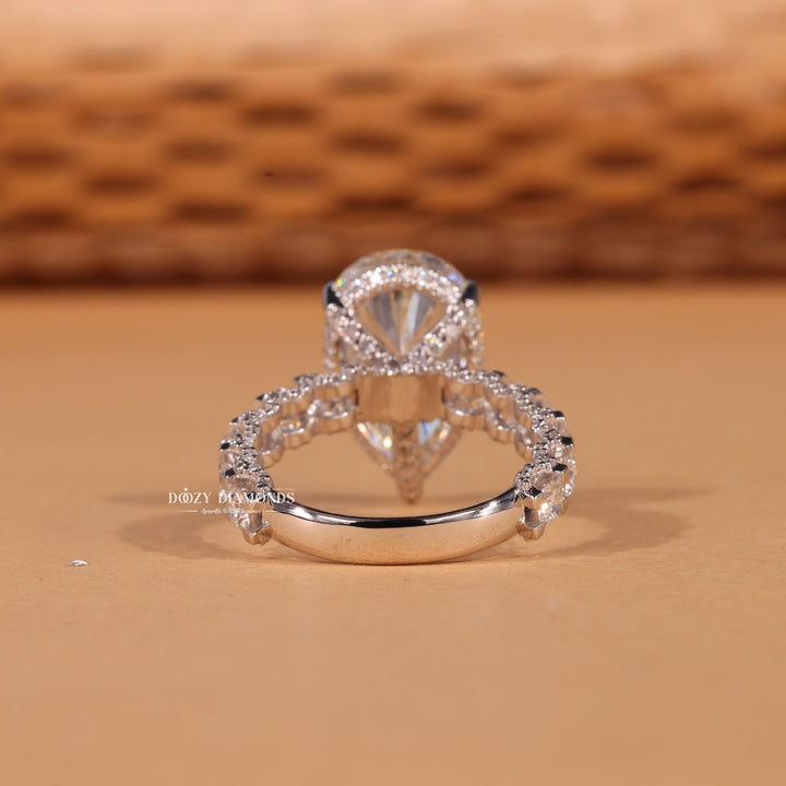 Pear pave engagement ring close-up highlighting diamond sparkle