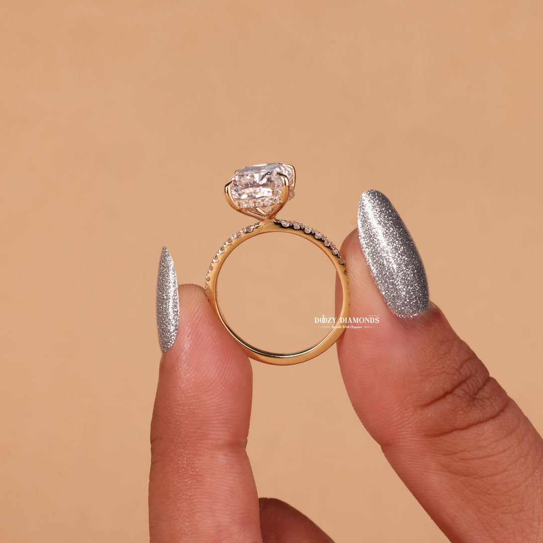 Cushion cut diamond ring worn on hand