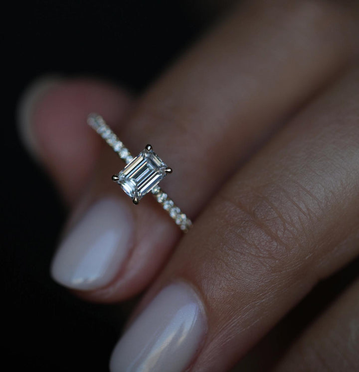 Certified emerald cut diamond featured in solitaire engagement ring