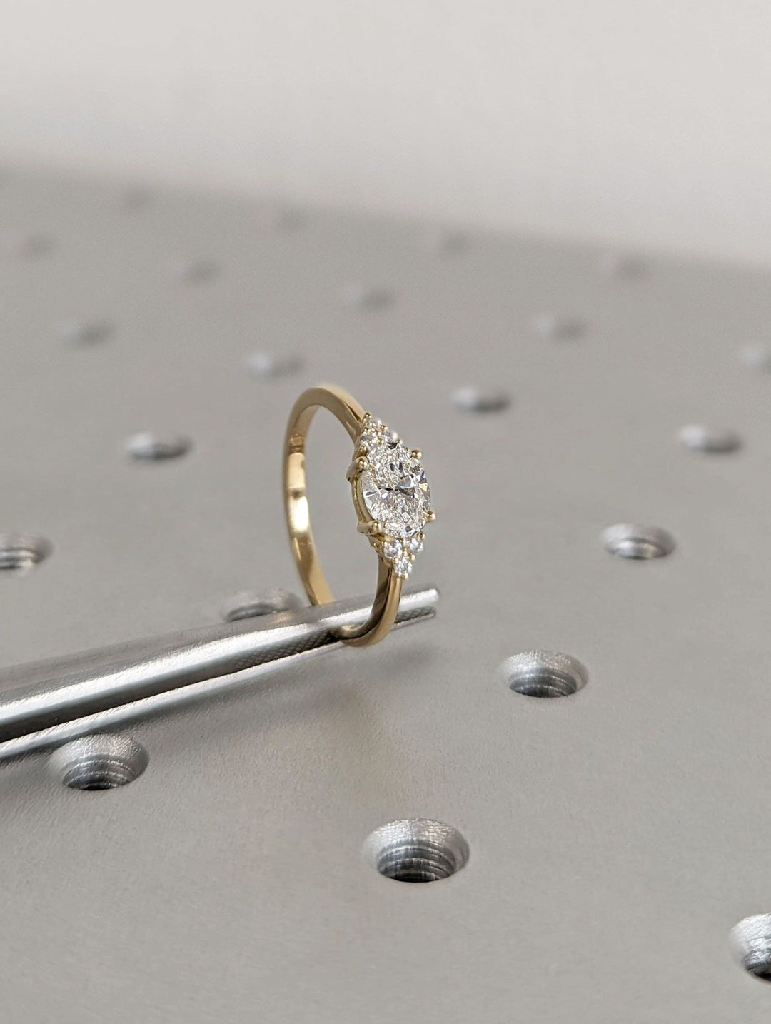 Oval east west diamond engagement ring available in multiple metals