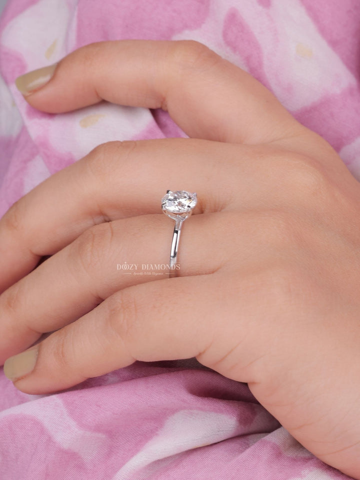 Detailed close-up of round solitaire diamond engagement ring