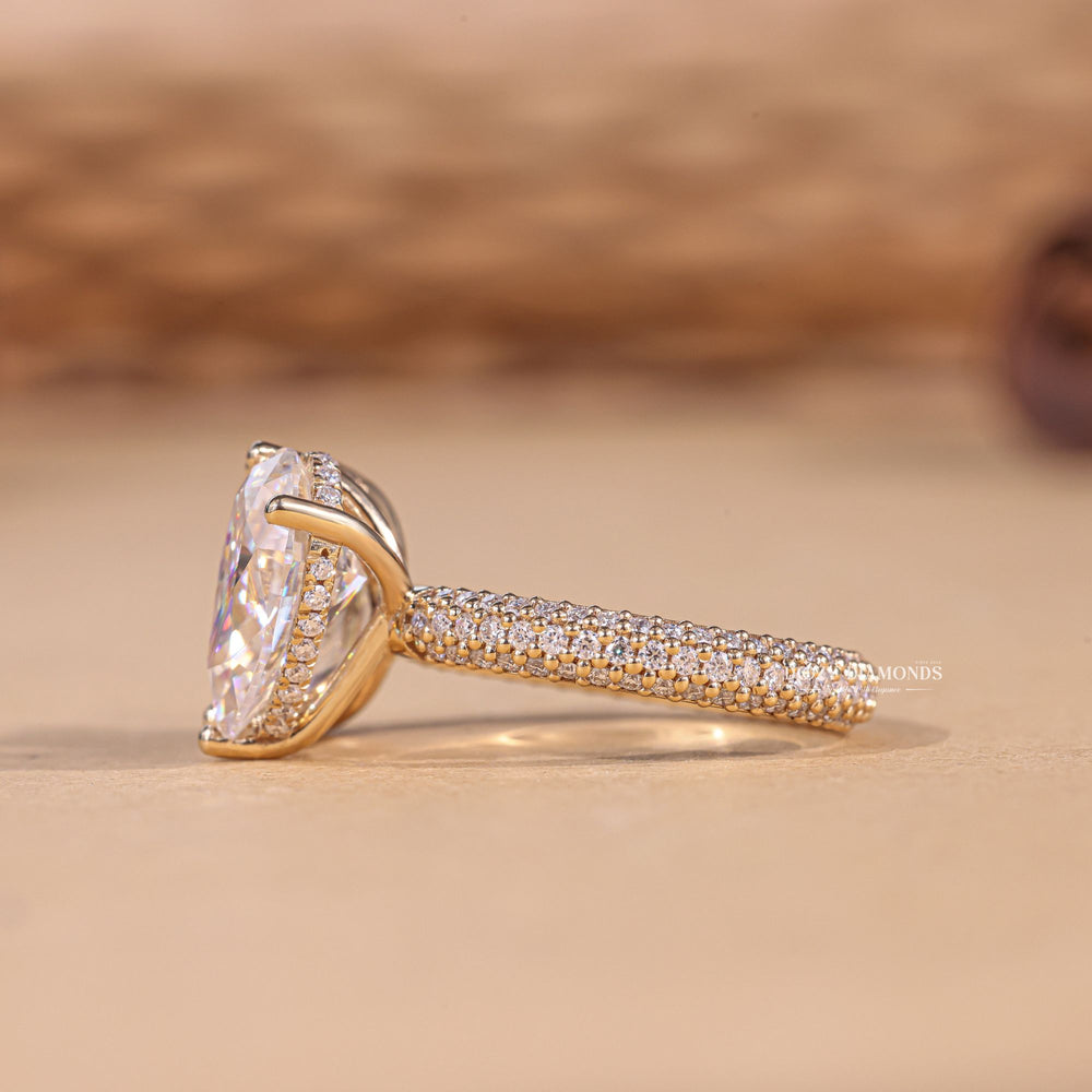 Pear solitaire engagement ring offered in gold and platinum