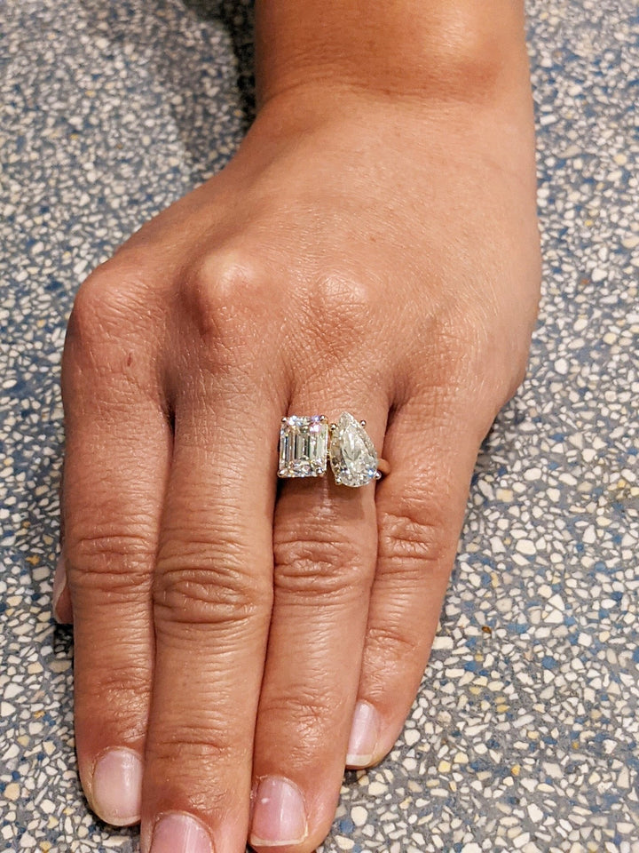Pear solitaire engagement ring shown on hand for true-to-life sizing