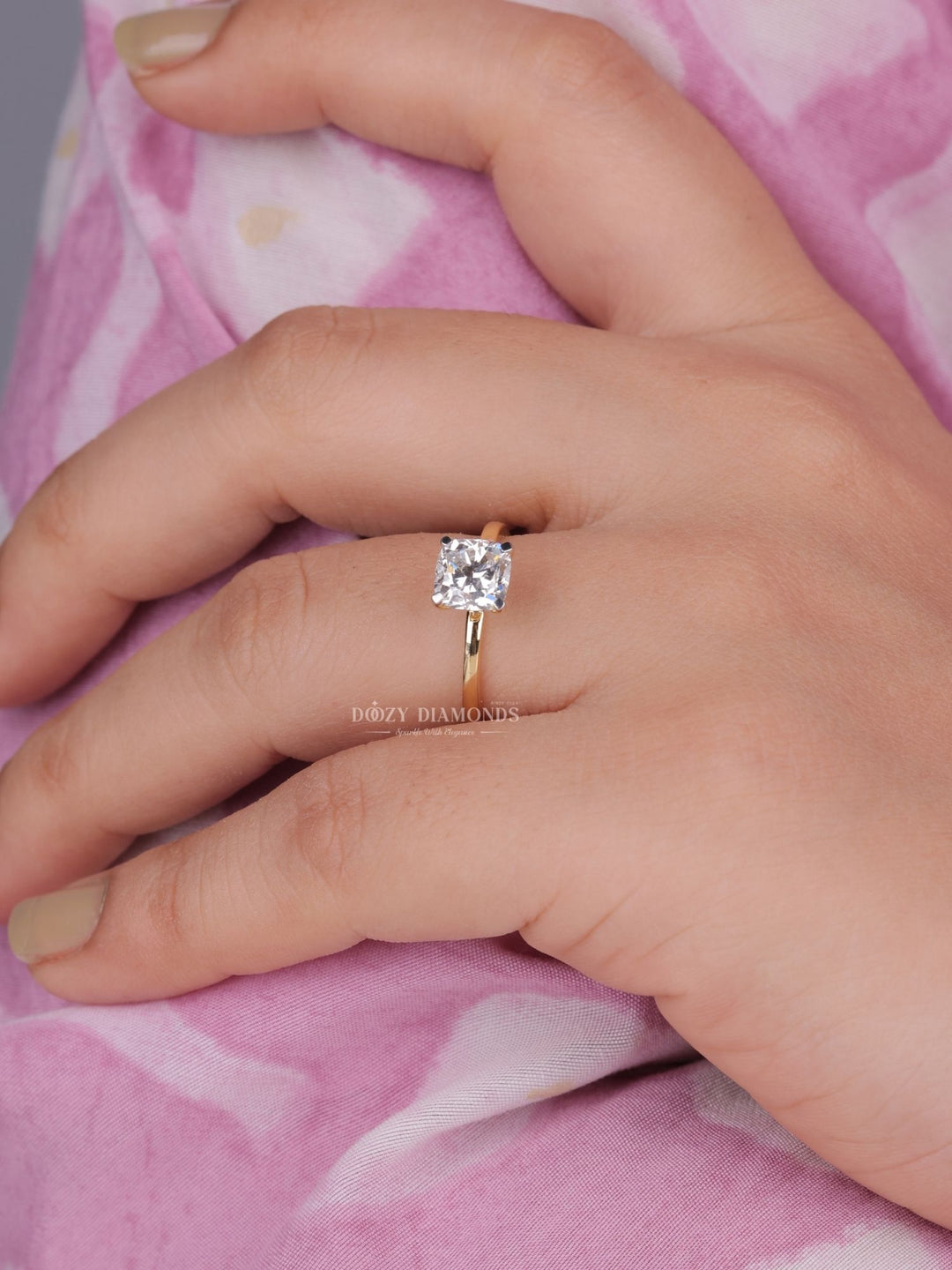 Cushion solitaire engagement ring finished in polished solid gold