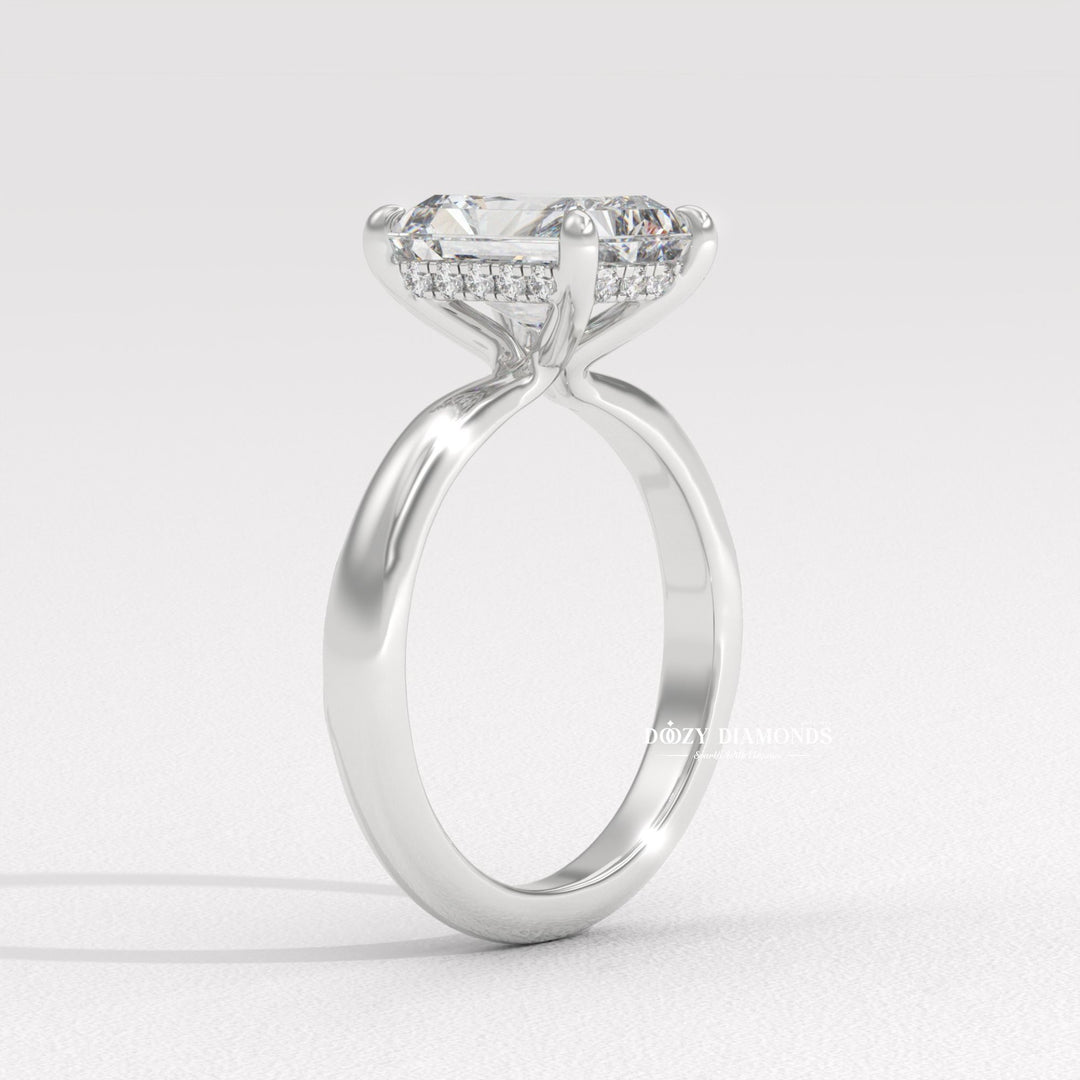Side angle of radiant hidden halo diamond engagement ring