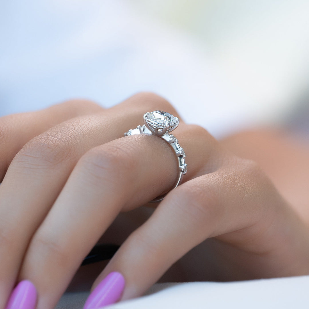 Cushion solitaire engagement ring offered in gold and platinum