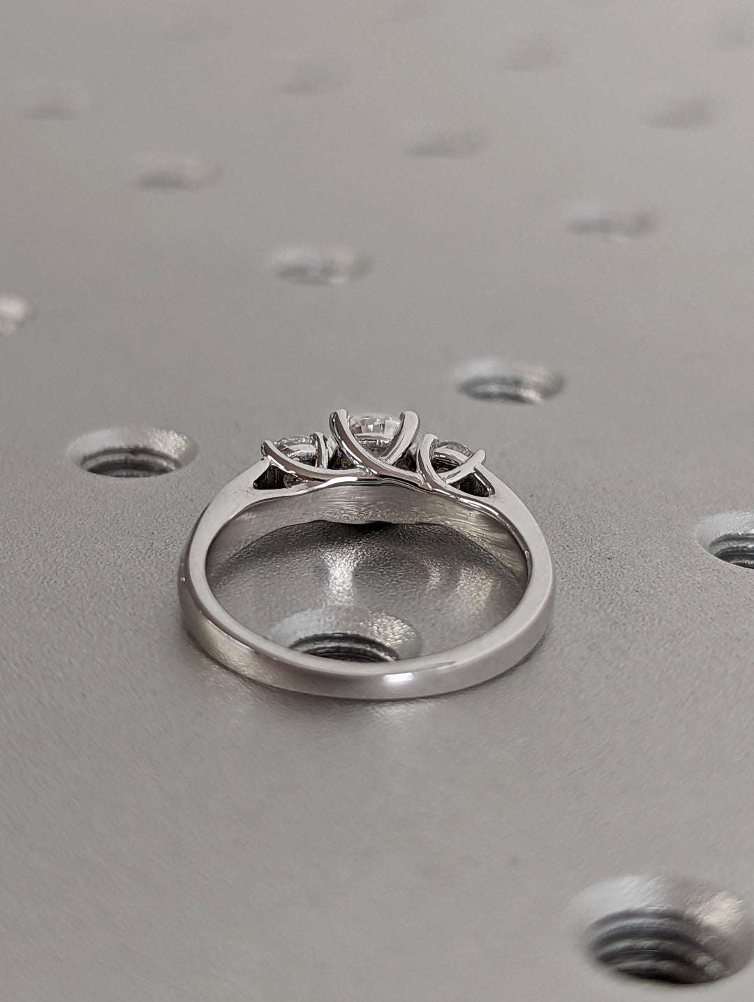 Round three stone lab grown diamond ring in jewelry gift box
