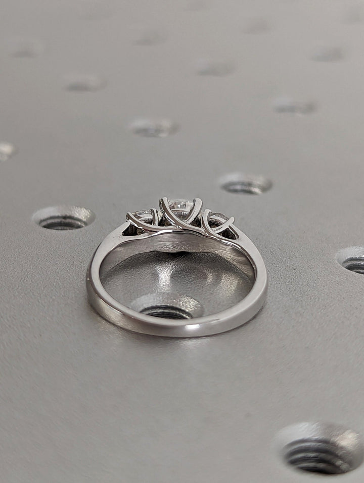 Round three stone lab grown diamond ring in jewelry gift box