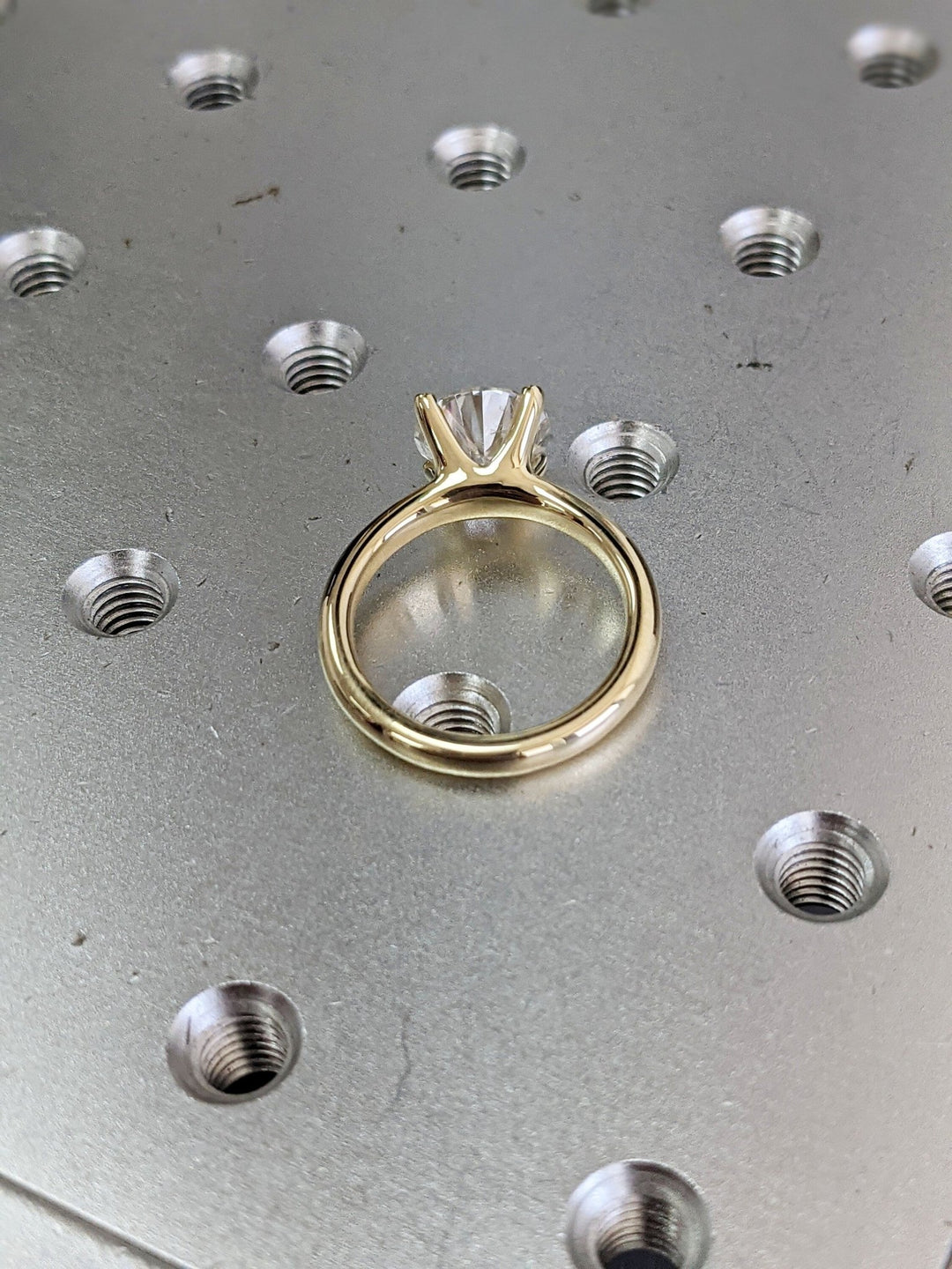 Round cut solitaire engagement ring shown in real-life wear