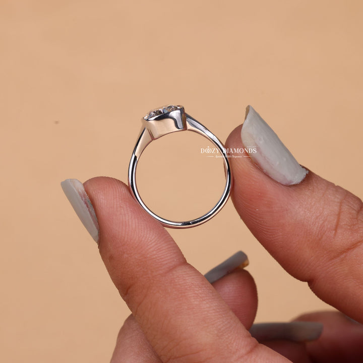 Cushion cut bezel engagement ring shown in real-life wear