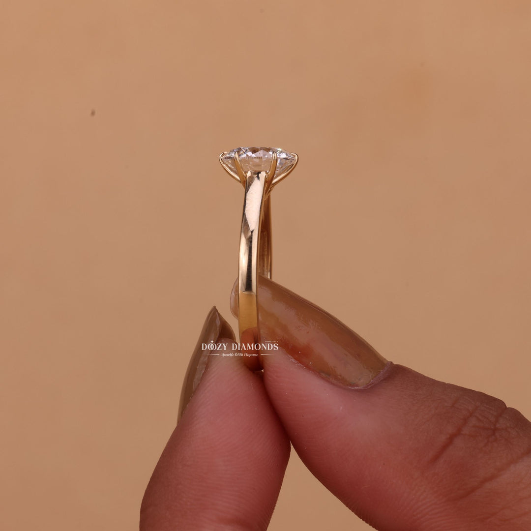 Round solitaire diamond engagement ring available in multiple metals