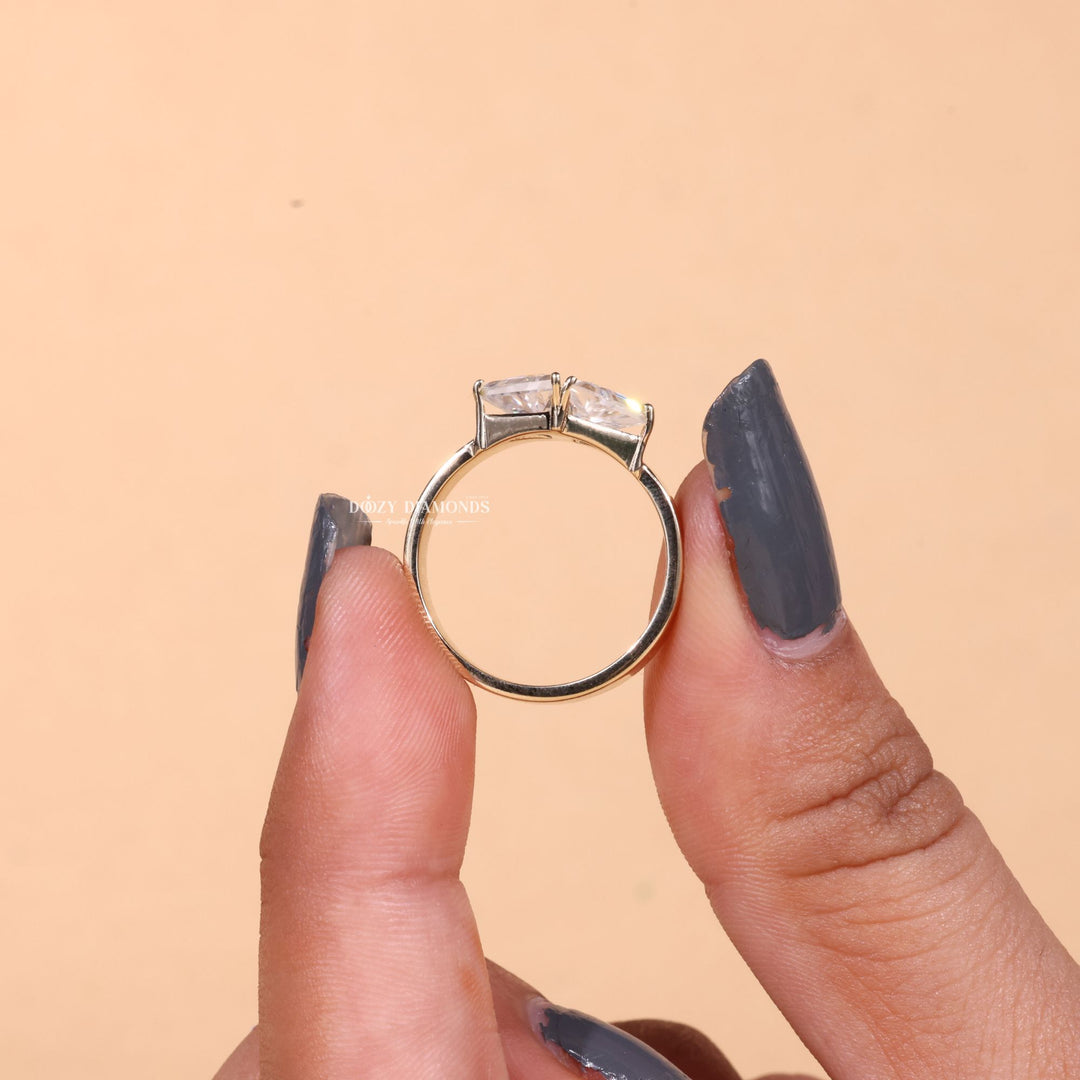 Toi et moi solitaire engagement ring finished in polished solid gold