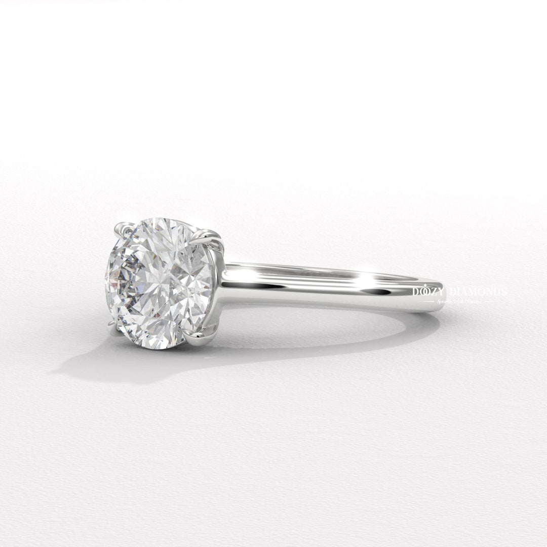 Lifestyle shot of round solitaire diamond ring on hand