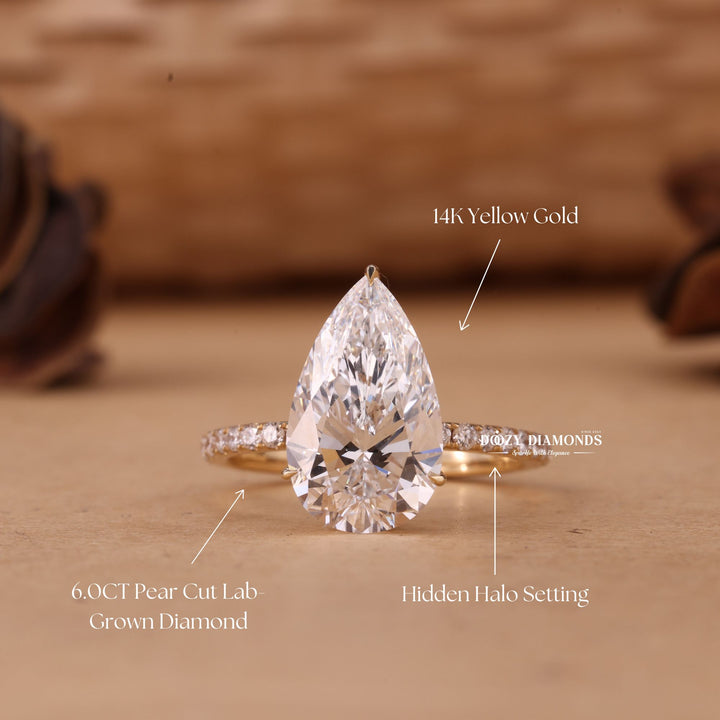 Pear cut hidden halo engagement ring shown in real-life wear