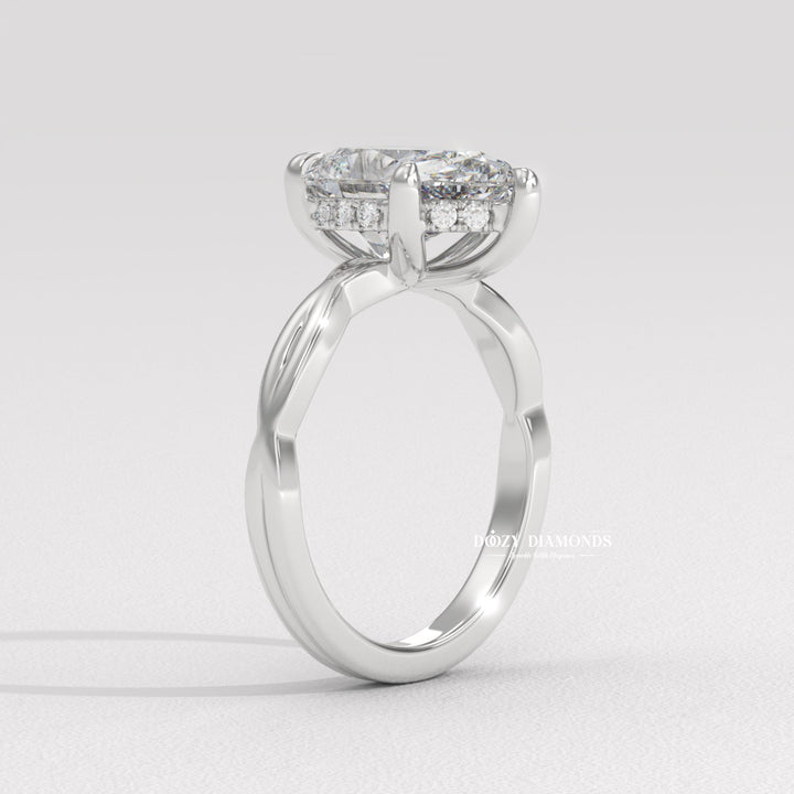 Pear solitaire lab grown diamond ring fitted on finger