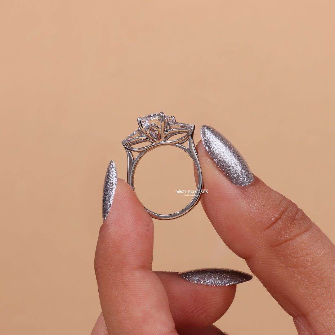Cushion cut three stone engagement ring shown in real-life wear