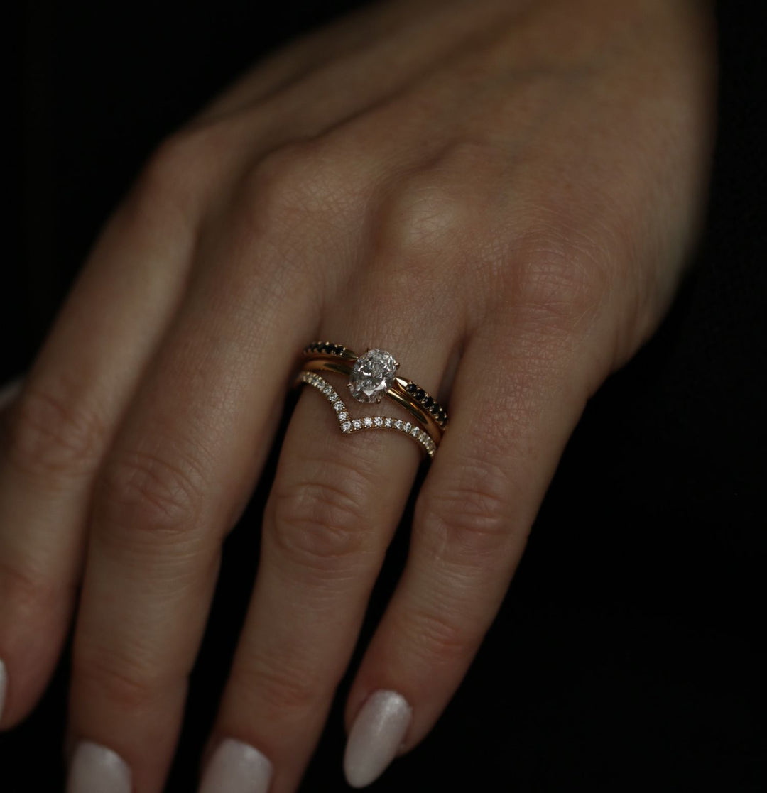 Oval solitaire engagement ring viewed from the side