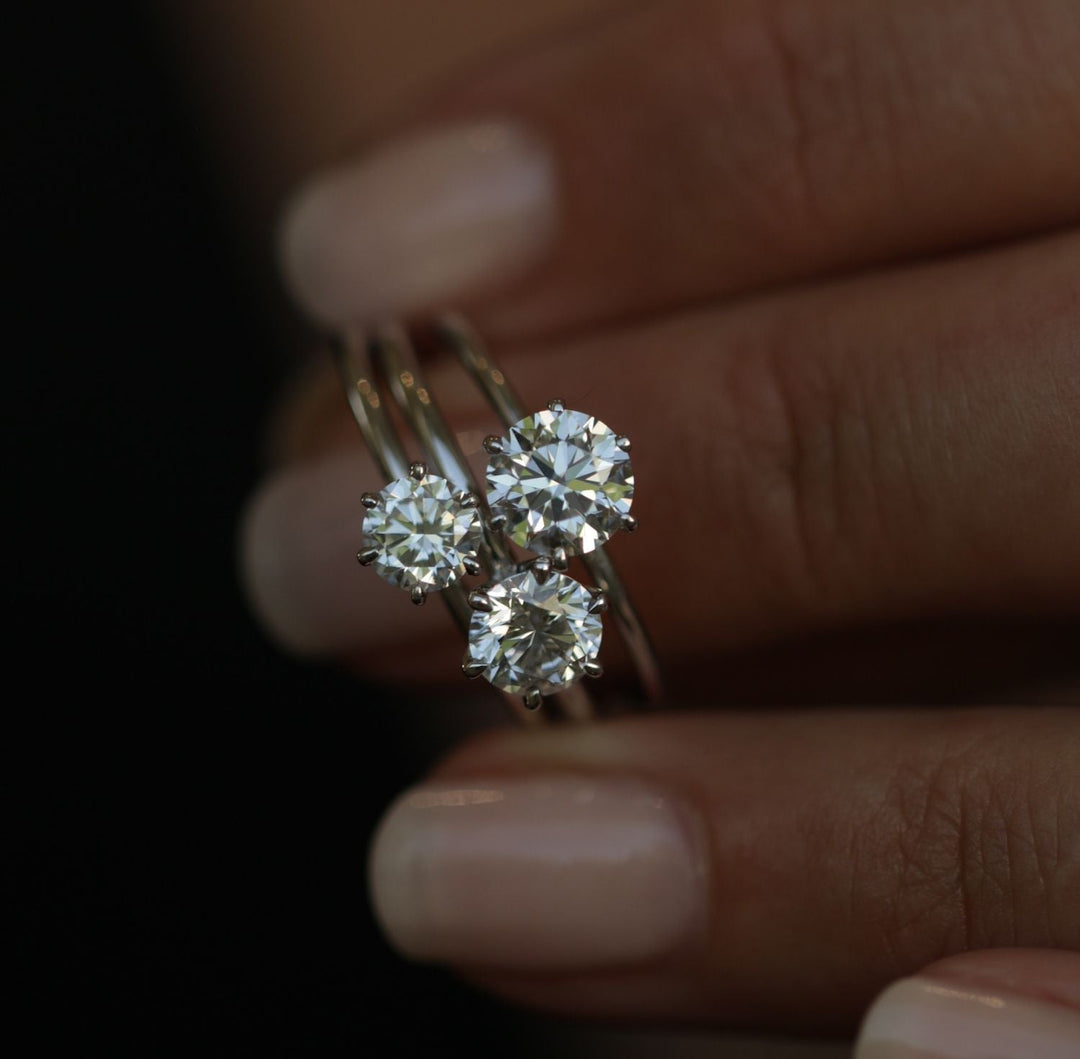 Round solitaire engagement ring photographed in natural light