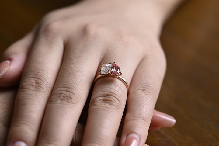 Pear cut engagement ring shown with authenticity certificate