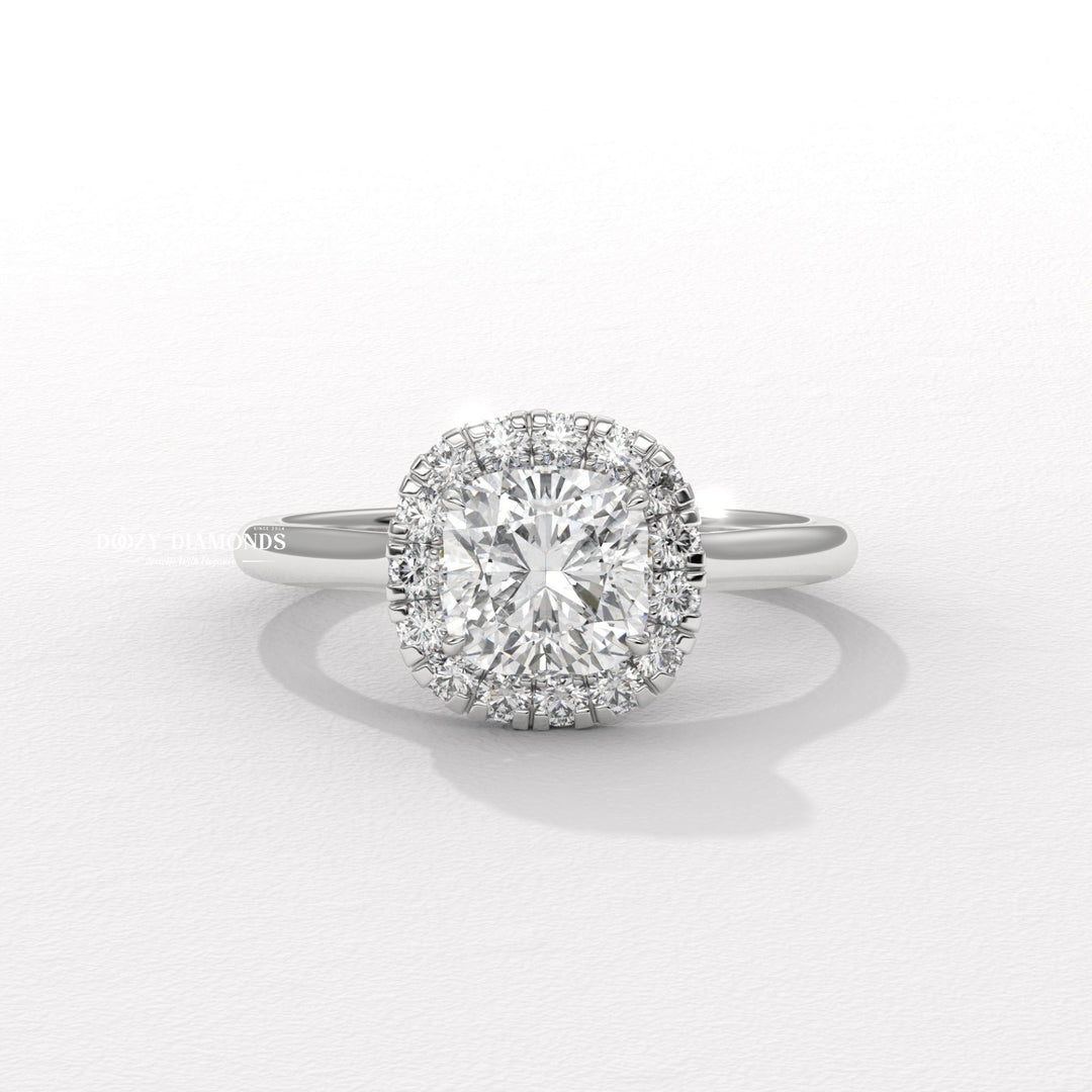 Cushion solitaire lab grown diamond ring fitted on finger