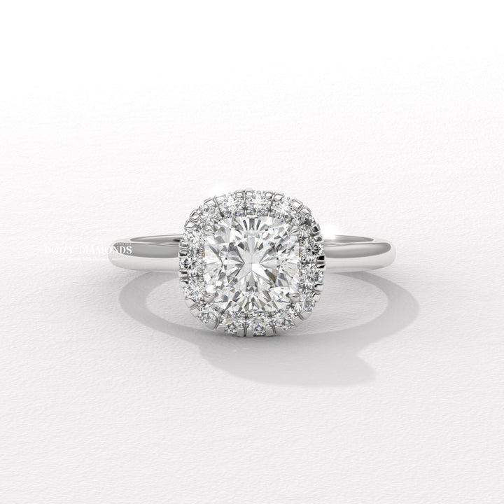 Cushion solitaire lab grown diamond ring fitted on finger