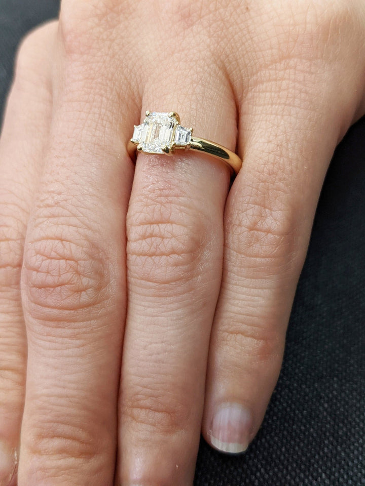 Profile view of emerald cut solitaire engagement ring band